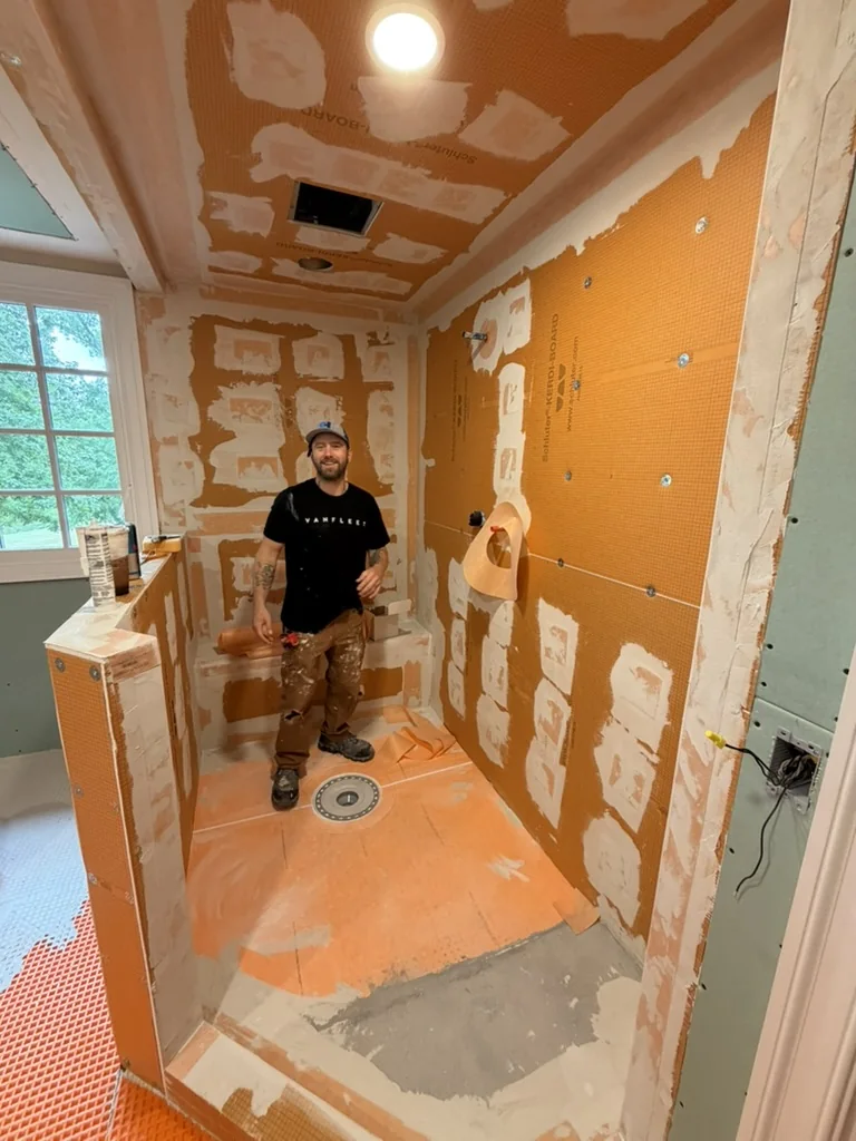 Primary shower prepared with Schluter boards and membrane before tile installation
