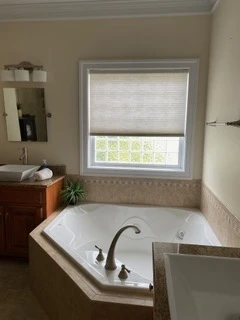 The tub & vanity area before the Greensprings West renovation