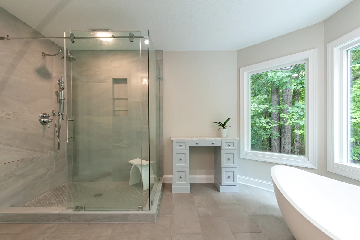 Old vanity → new shower after remodeling by VanFleet Homes in Toano
